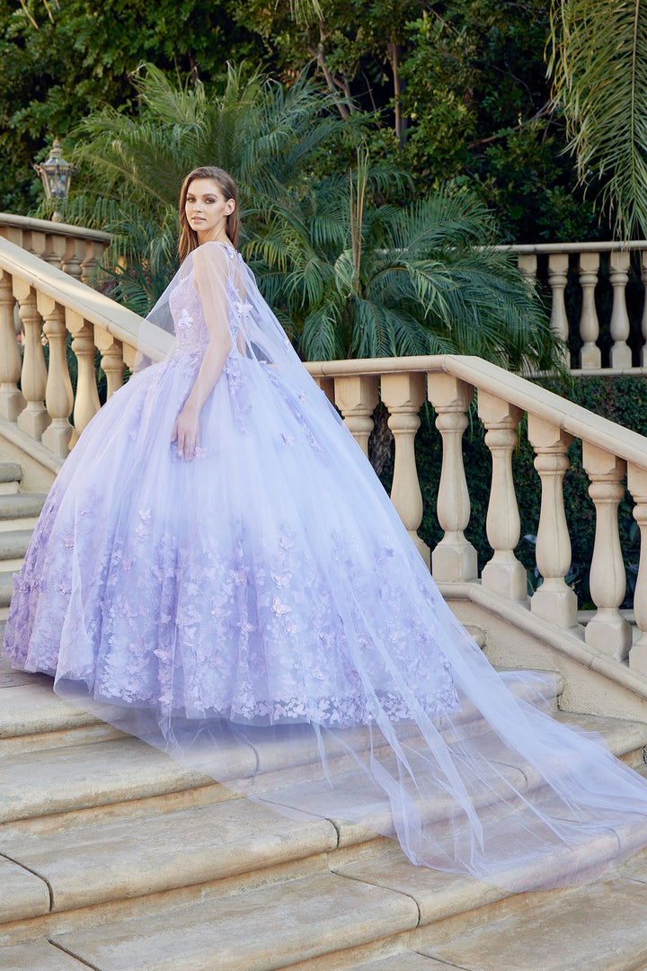 Juliet 1442 butterfly appliqué cape quinceanera dress three-quarter view with sheer cape on staircase