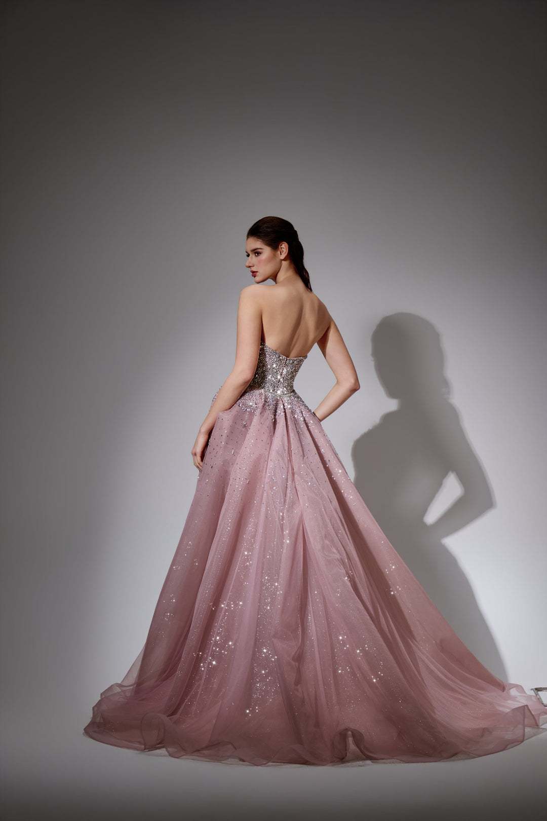 Delilah LD21176 Strapless Sequin Mermaid Gown with Glitter Full Overskirt - Pink back view