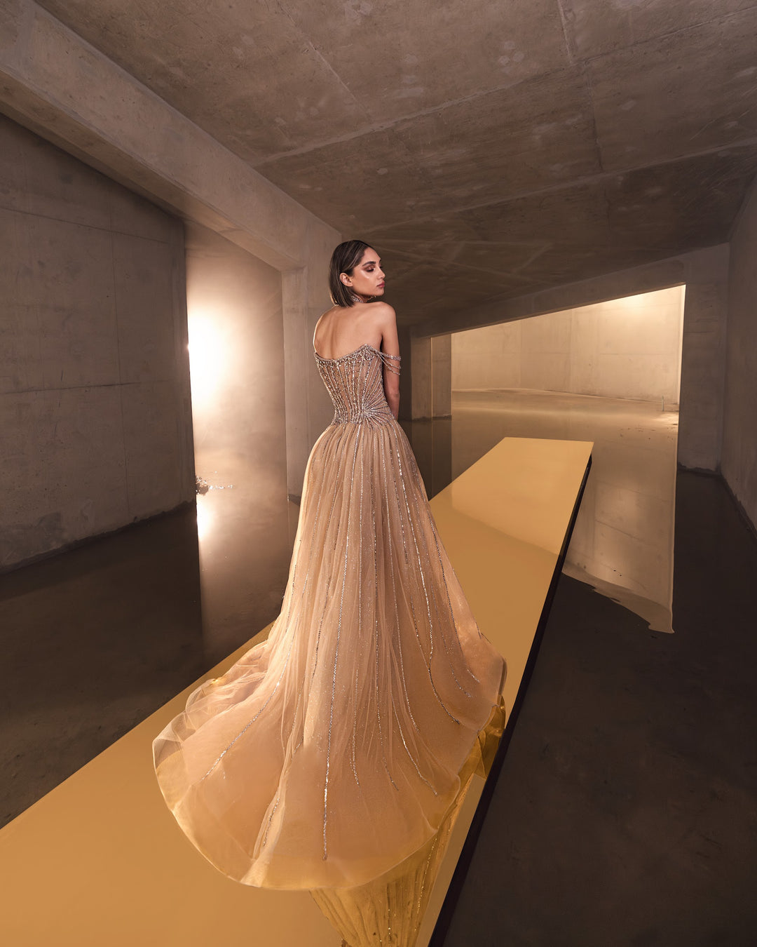 Delilah LD11671 Strapless Sunburst Crystal Corset A-Line Gown with Slit - Champagne back view