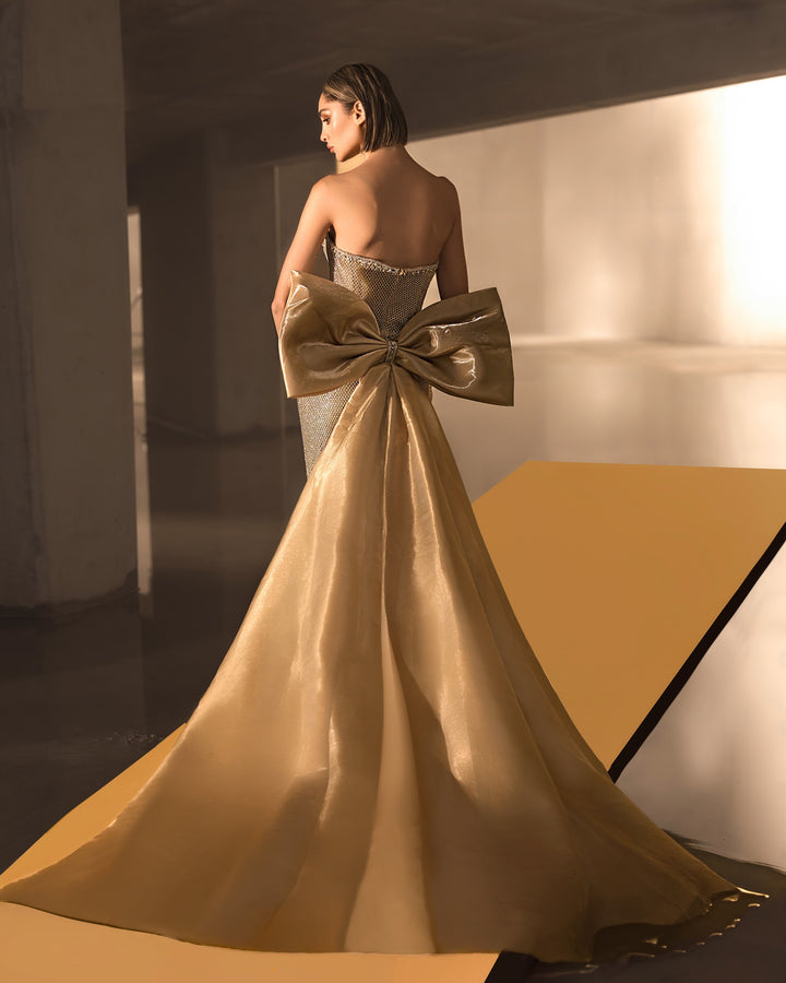 Delilah LD12064 Strapless Crystal Cup Mermaid Gown with Oversized Back Bow Train - Champagne back view