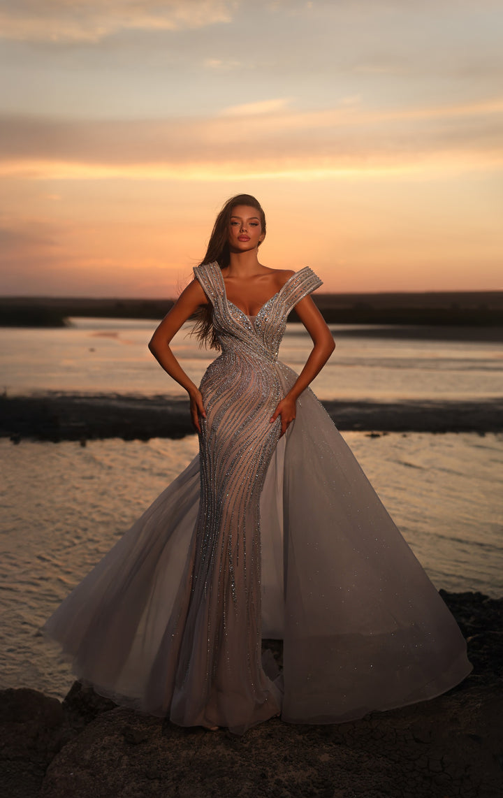 Delilah LD11463 Off-Shoulder Wrap Beaded Mermaid Gown with Asymmetric Tulle Overskirt - Grey front view