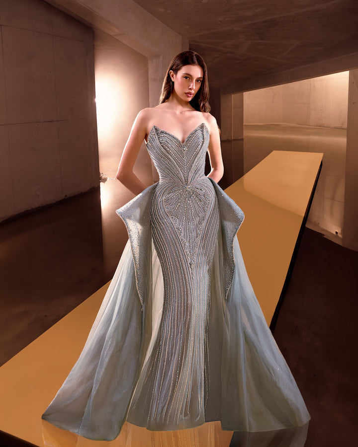 Delilah LD12089 Strapless Plunging Crystal Mermaid Gown with Peplum and Tulle Overskirt - Green front view