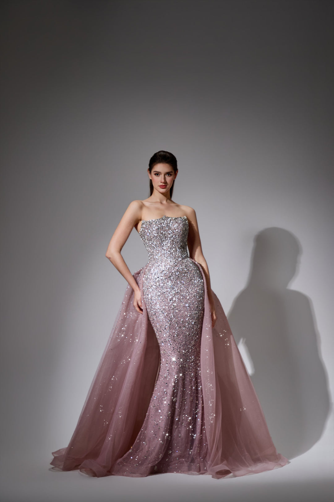 Delilah LD21176 Strapless Sequin Mermaid Gown with Glitter Full Overskirt - Pink front view