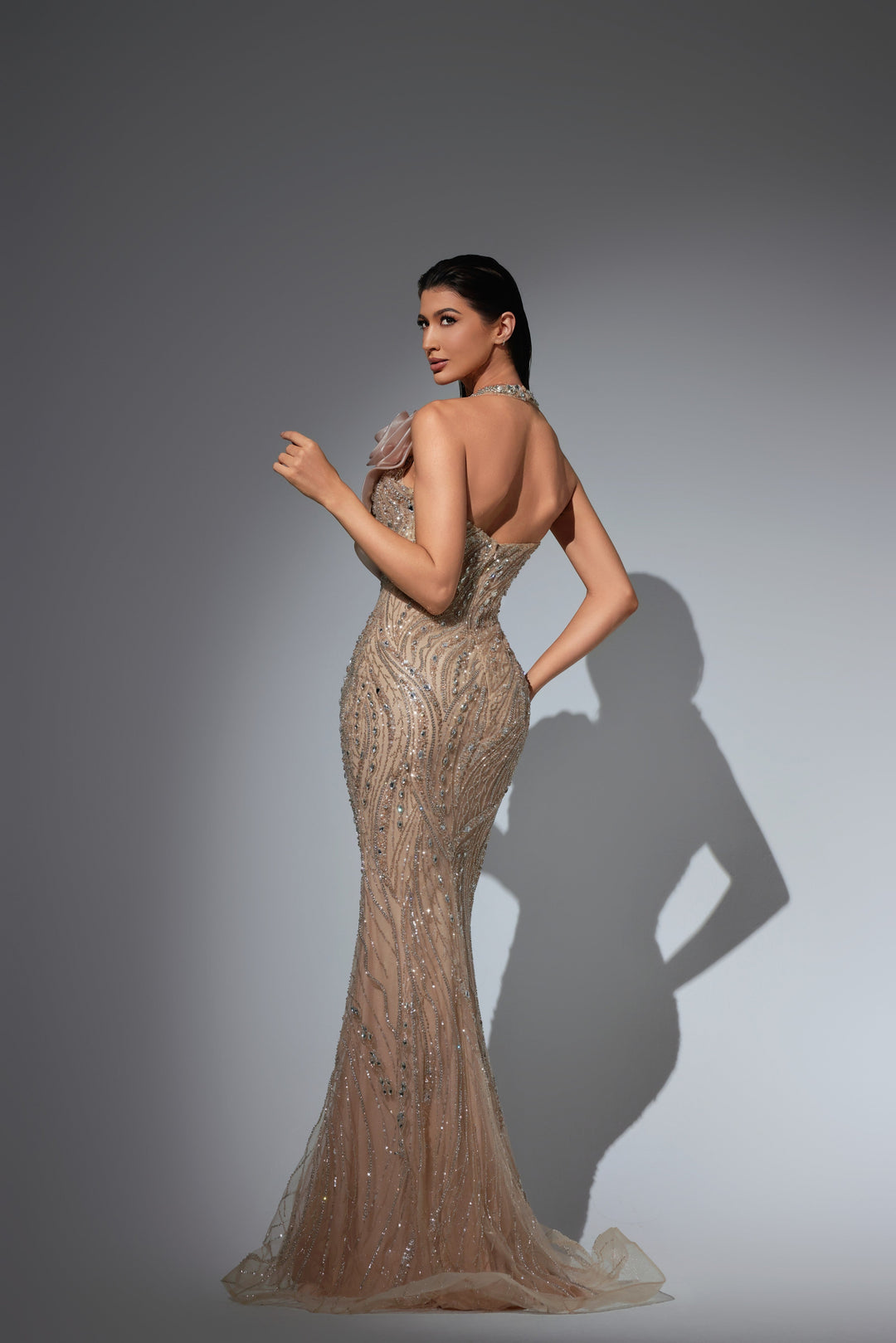Delilah LD21121 Plunging Halter Beaded Mermaid Gown with 3D Rosette Shoulder - Champagne back view