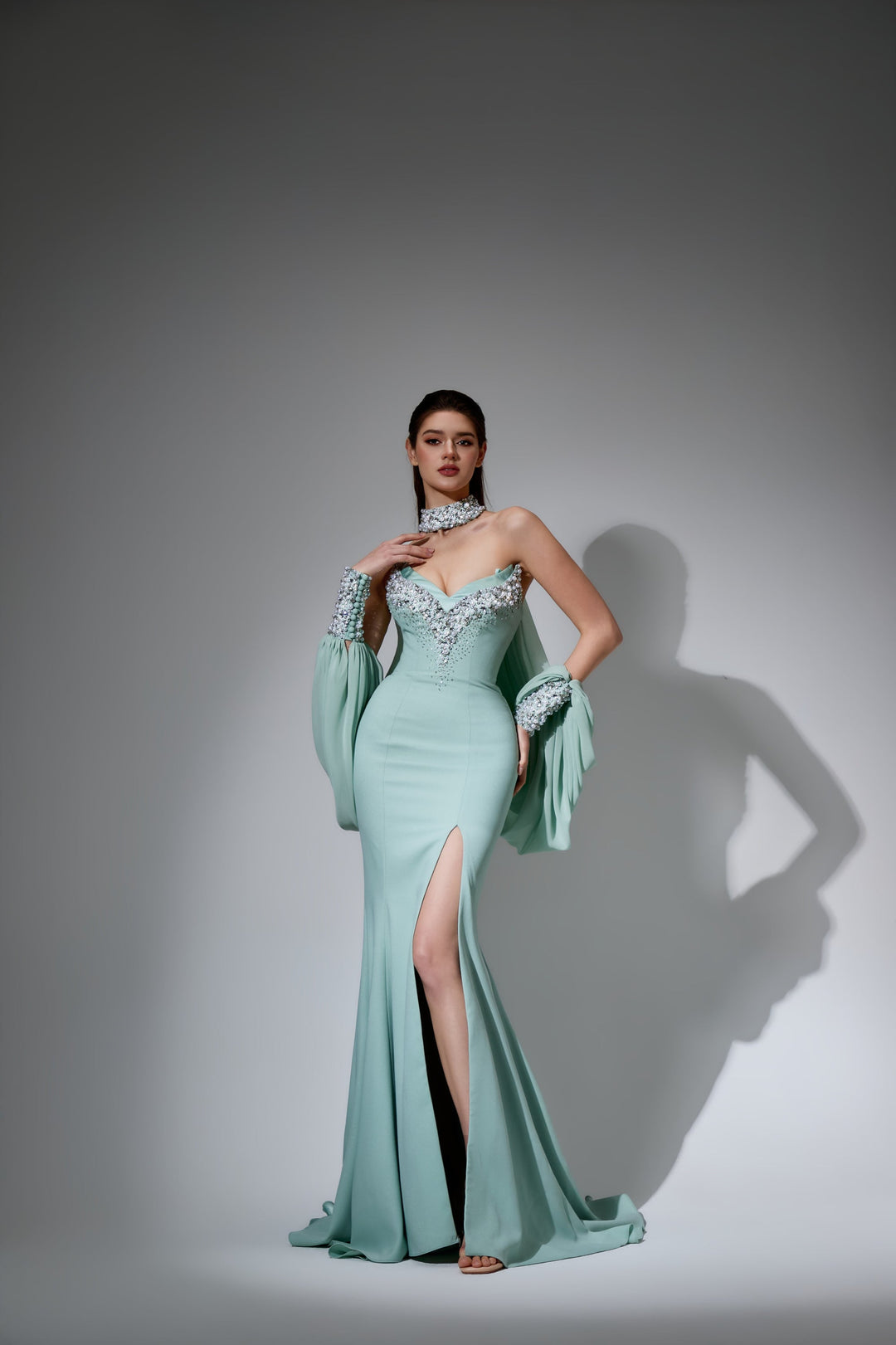 Delilah LD41040 Strapless Sweetheart Mermaid Gown with Crystal Choker, Draped Sleeves and Slit - Mint front view