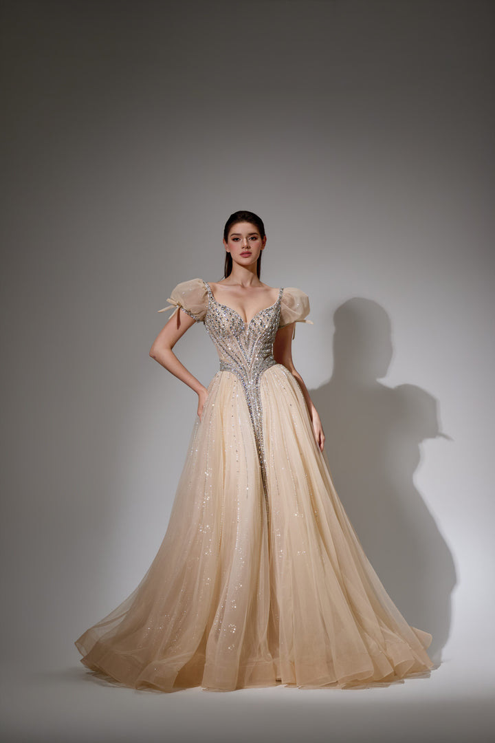 Delilah SH11608 Plunging Beaded Corset Ball Gown with Puff Sleeves - Champagne front view