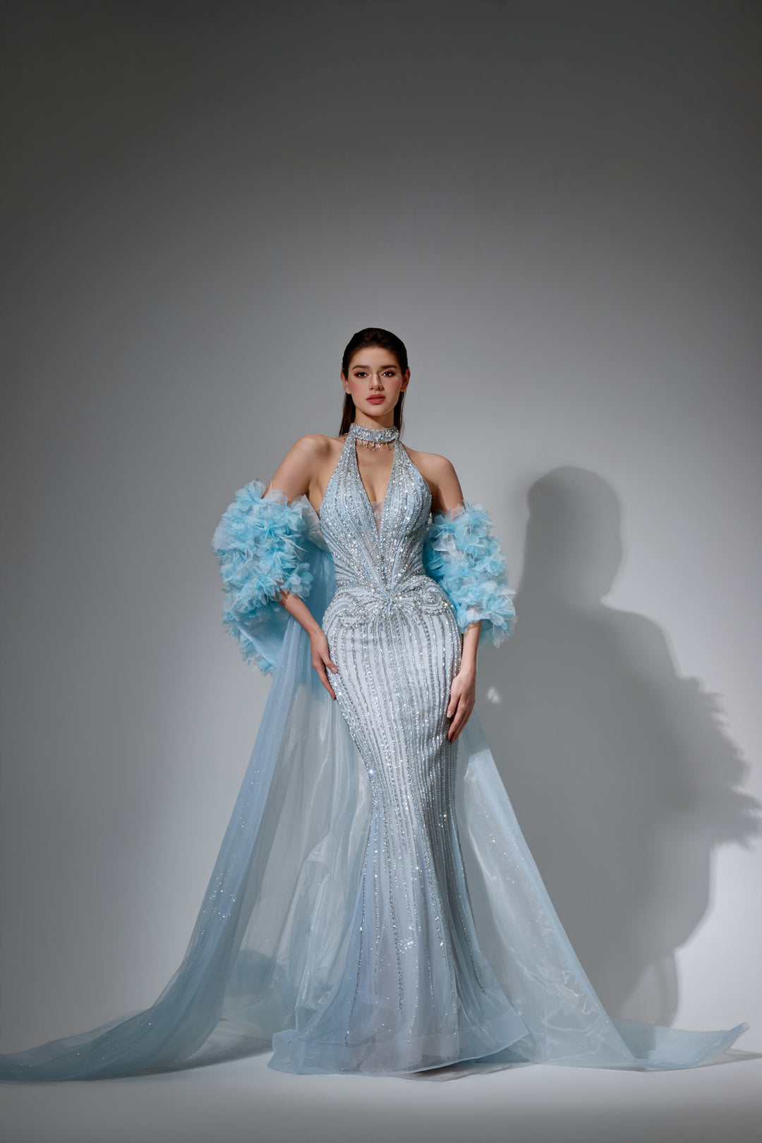 Delilah SH12045 Beaded Halter Plunging Mermaid Gown with Ruffled Arm Puffs and Overskirt - Blue front view