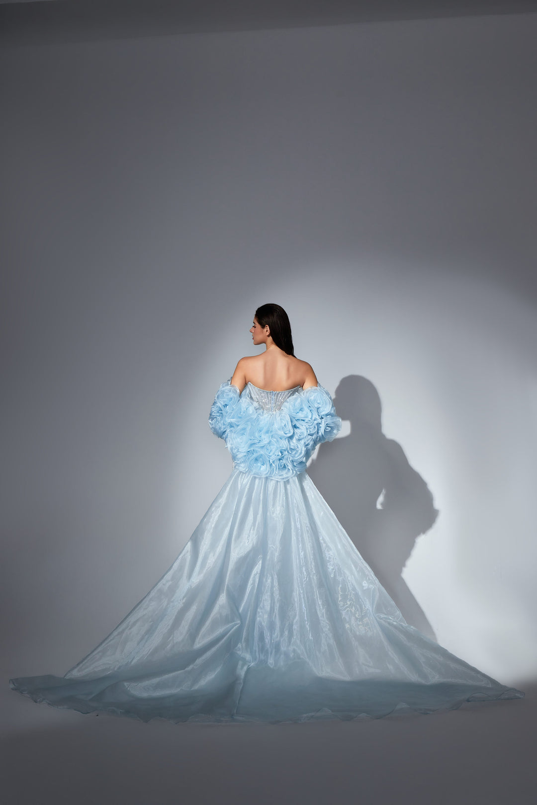Delilah SH12052 Plunging Beaded Corset Mermaid Gown with Rosette Arm Puffs and Overskirt - Blue back view