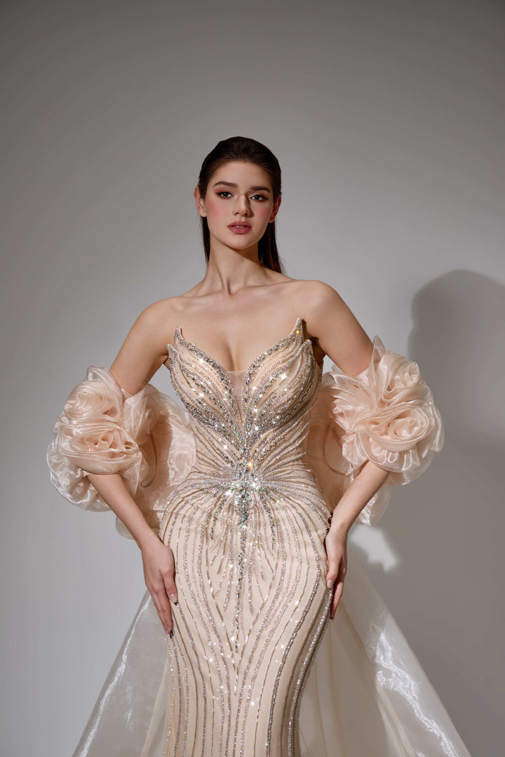 Delilah SH12052 Plunging Beaded Corset Mermaid Gown with Rosette Arm Puffs and Overskirt - Champagne close-up view